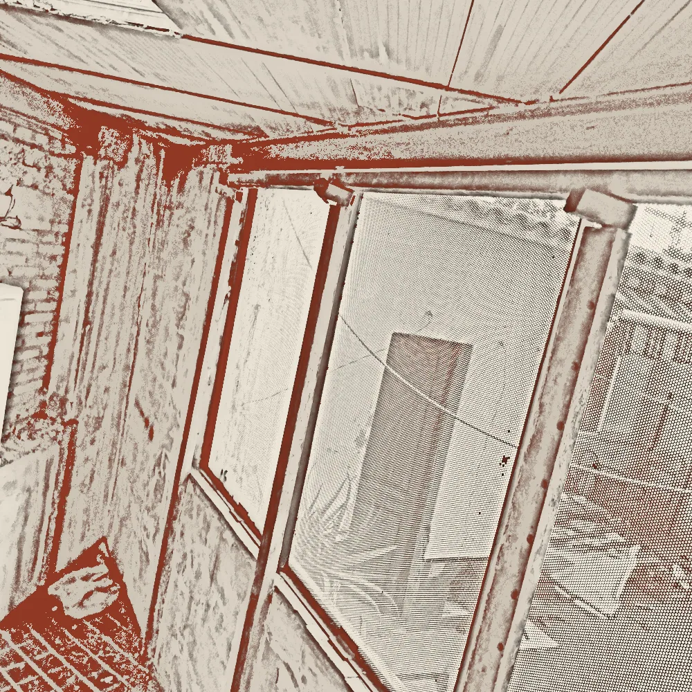 Local transformado en vivienda: escalera nueva sobre muro de piedra original